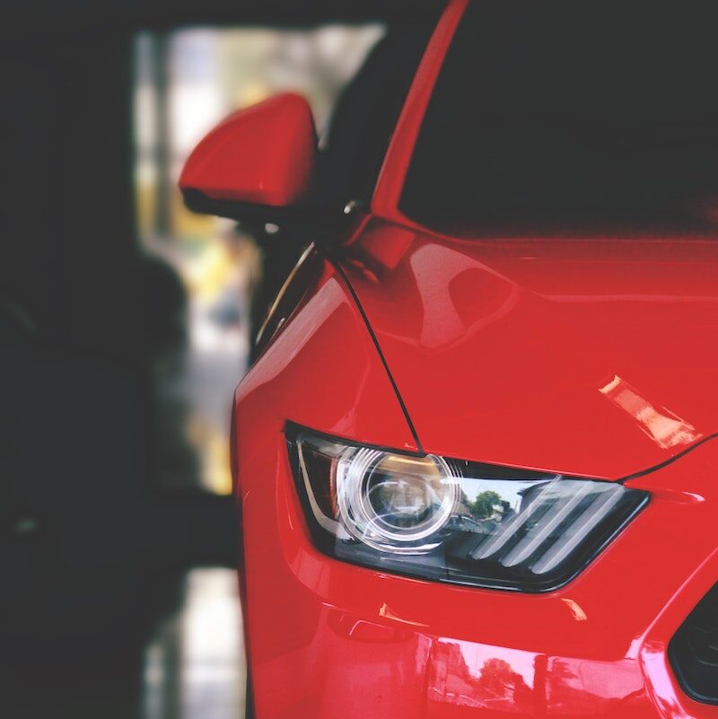 Red Car Parked on Pavement